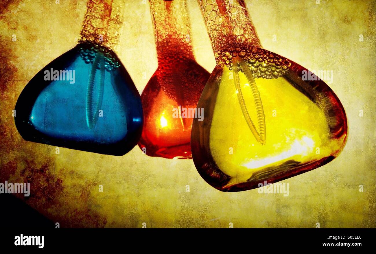 Bottles of coloured soap solution Stock Photo Alamy