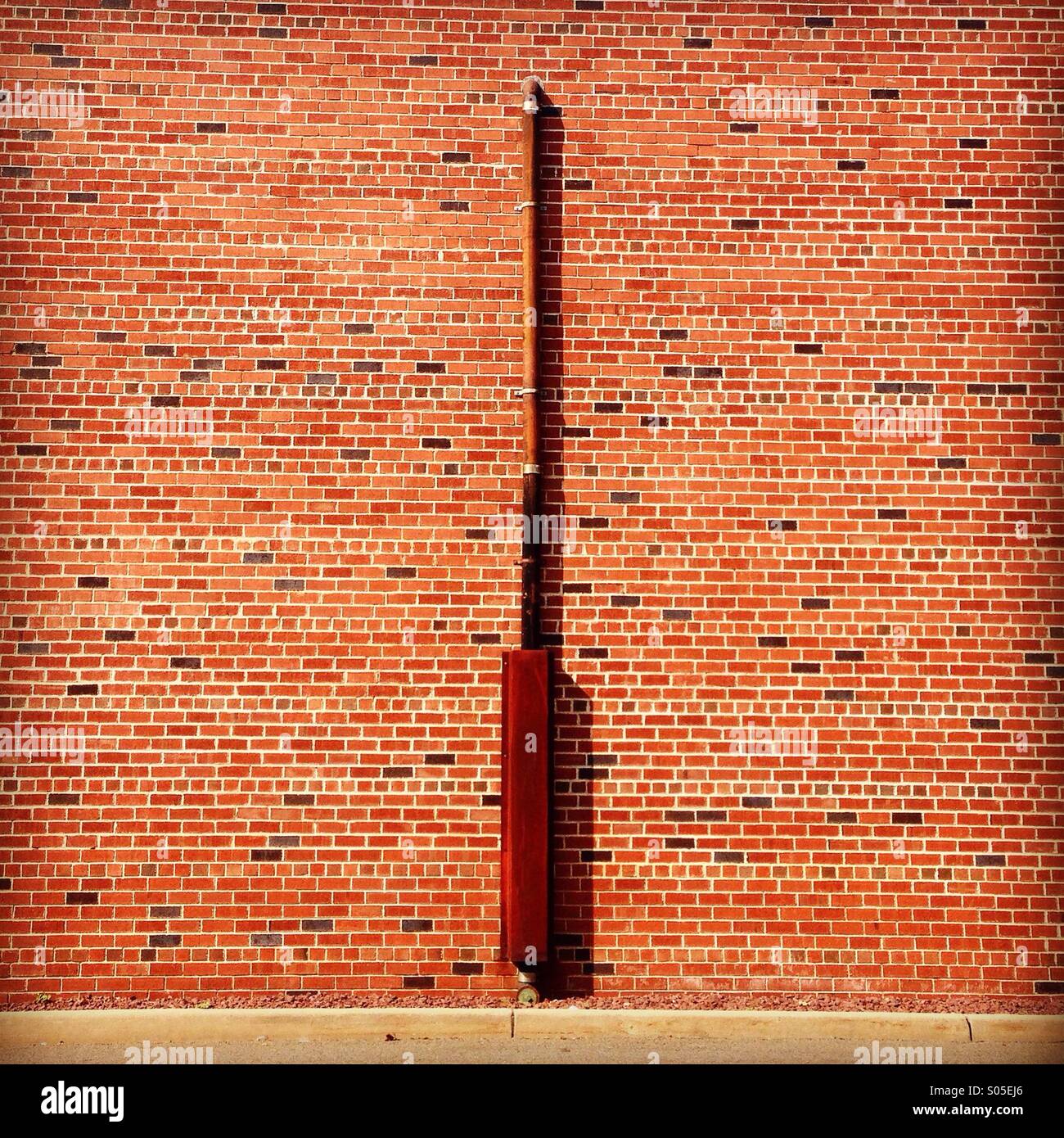 Brick wall and pipe. New Jersey. Stock Photo