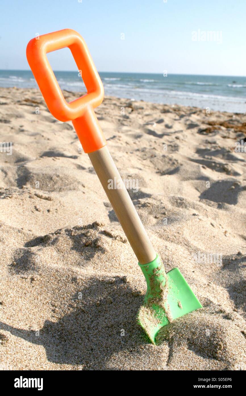 Sand shovel at the beach Stock Photo Alamy
