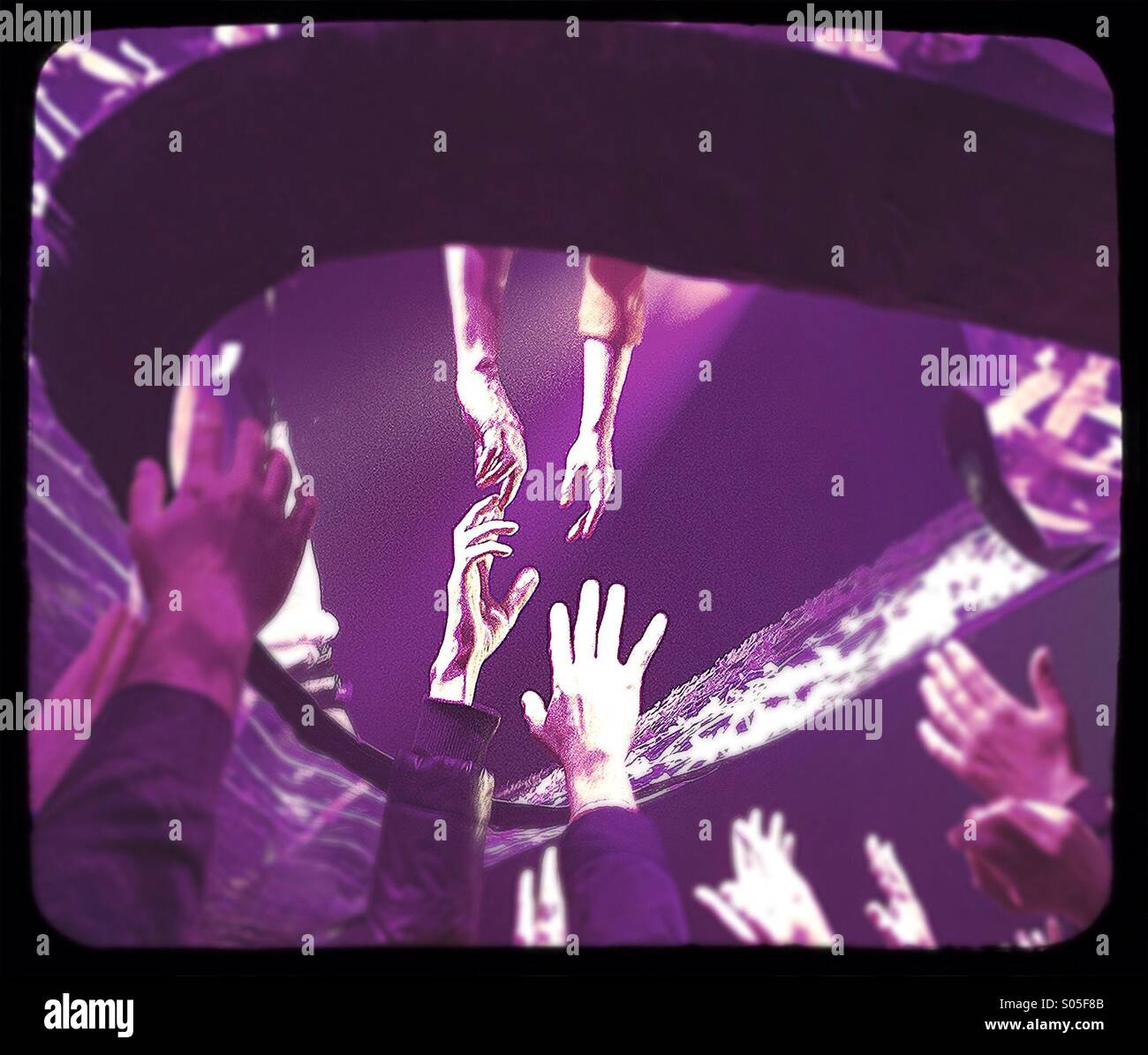 Helping hands. Acrobatic show. Stock Photo