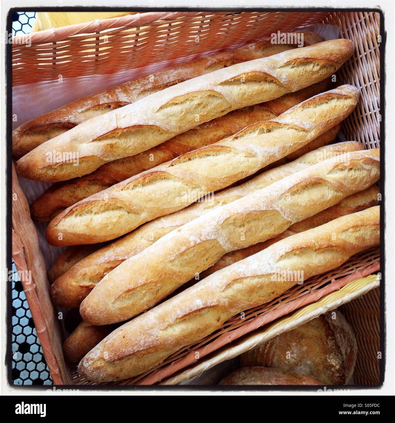 A box of baguettes at a bakery Stock Photo
