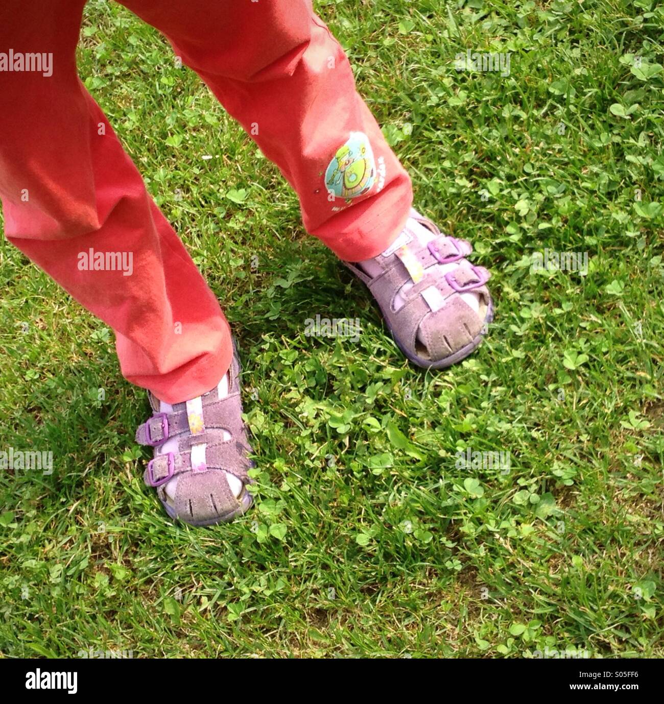 Not recognizable child in the garden - Smartphone Captured Stock Image