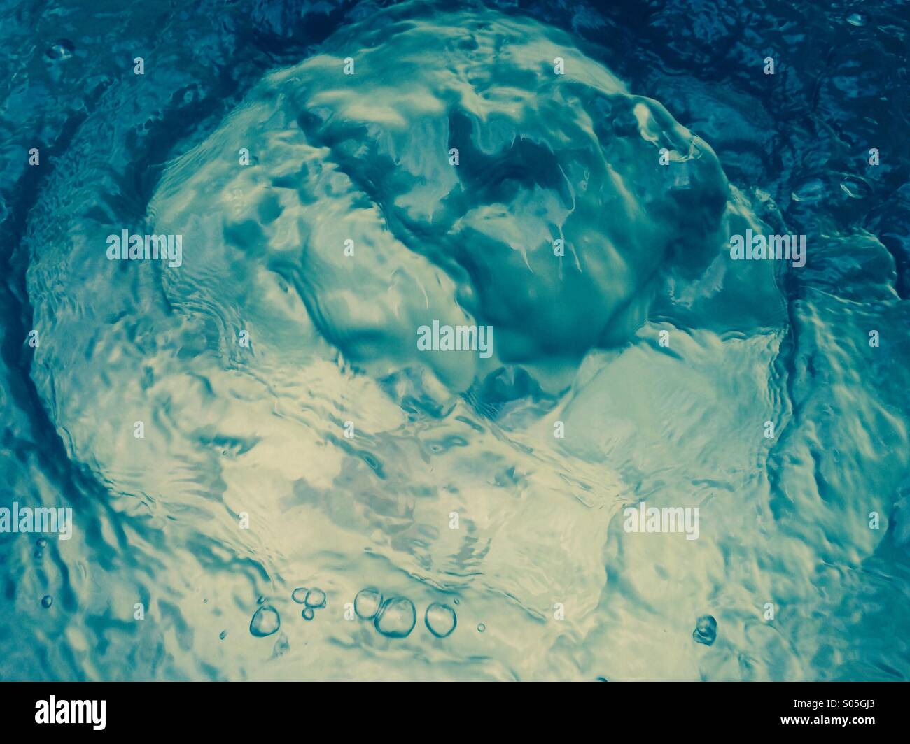 Bubbling water at a fountain. Stock Photo