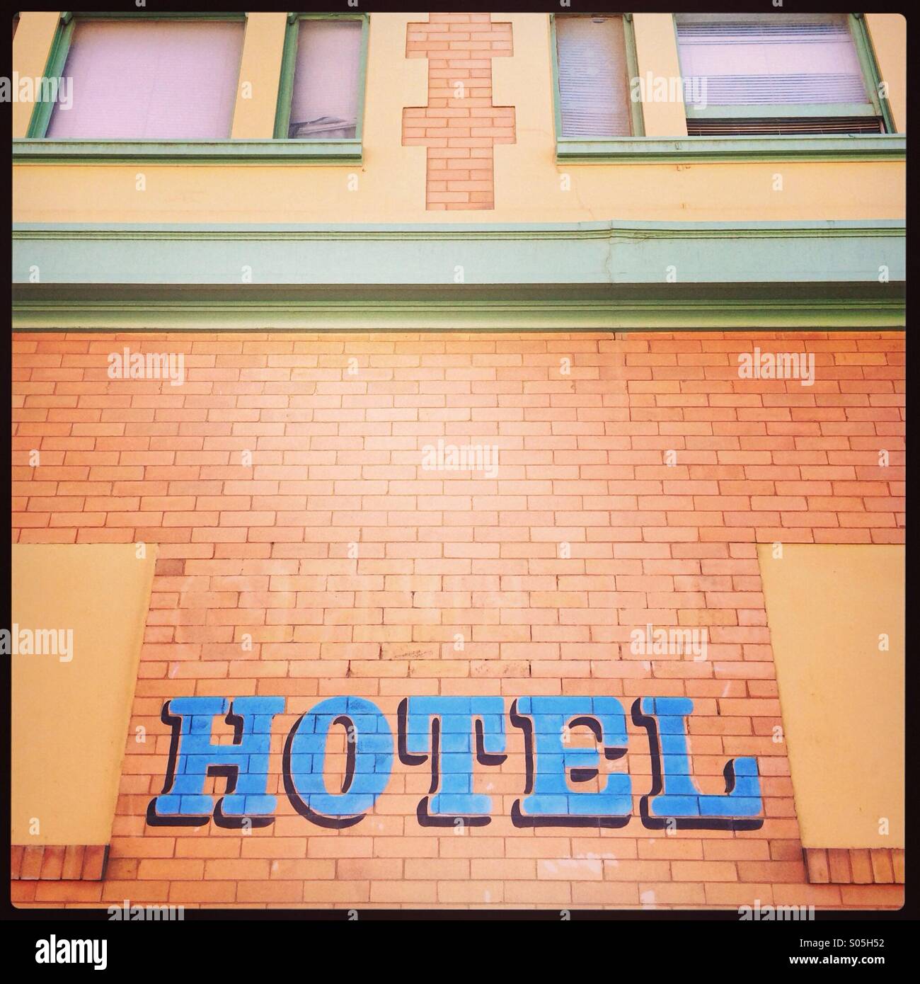 Hotel sign on pink building - Smartphone Captured Stock Image Hotel sign on pink building - Smartphone Captured Stock Image