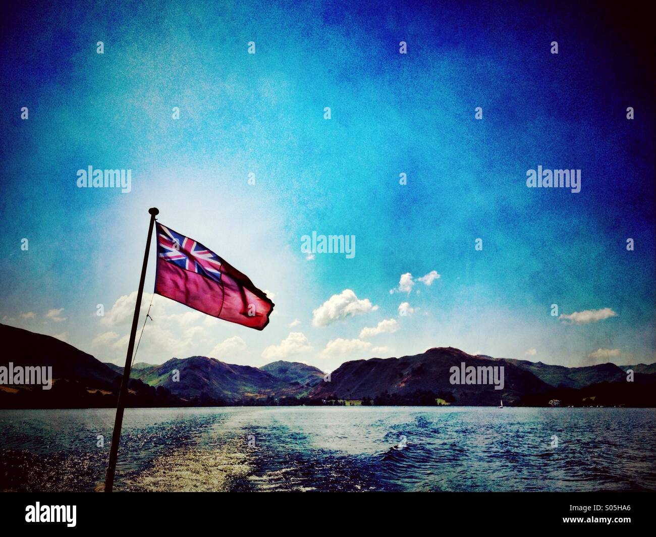 Ensign flag blowing in wind on Ullswater - Smartphone Captured Stock Image
