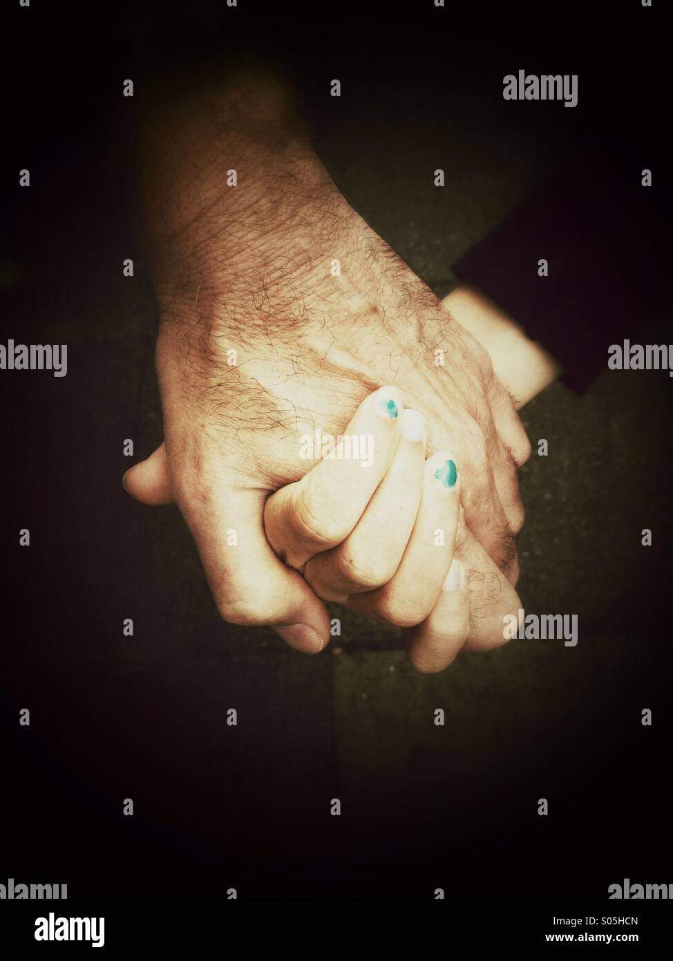 Close up of adult and child holding hands Stock Photo - Alamy