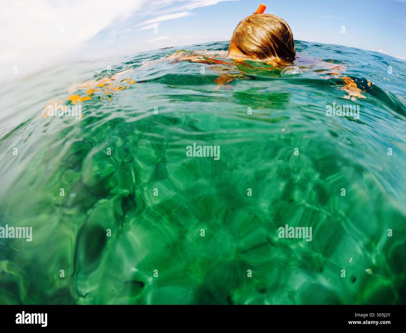 Little girl searching underwater Stock Photo