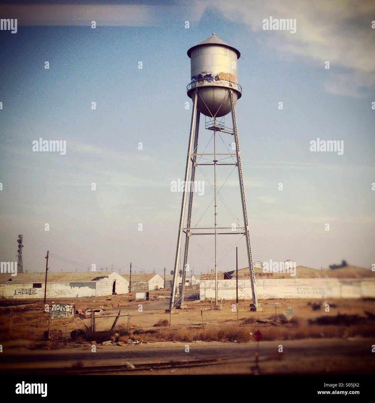 Small town water tower photo taken from train Stock Photo