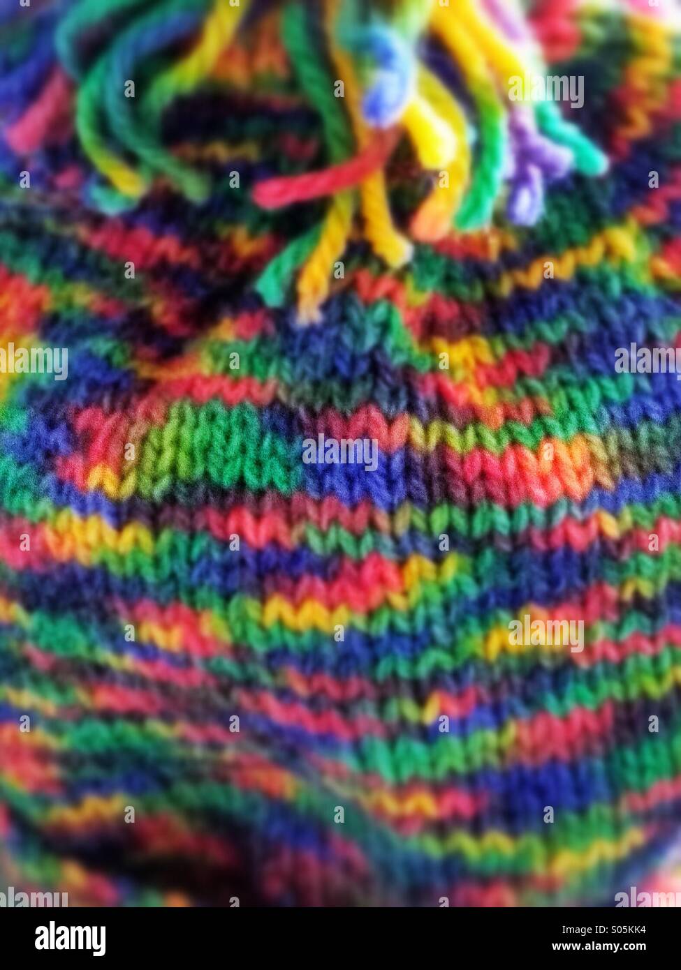 Colourful close up multi coloured knitting.  Mobile phone photo with some phone or tablet post processing. - Smartphone Captured Stock Image