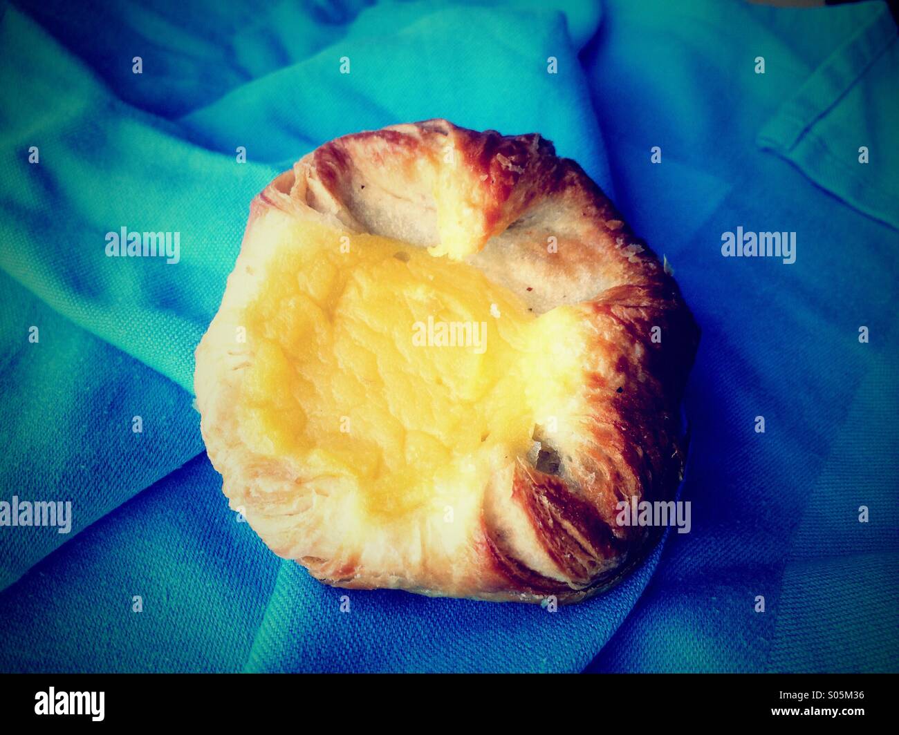 A Danish pastry on a napkin. - Smartphone Captured Stock Image