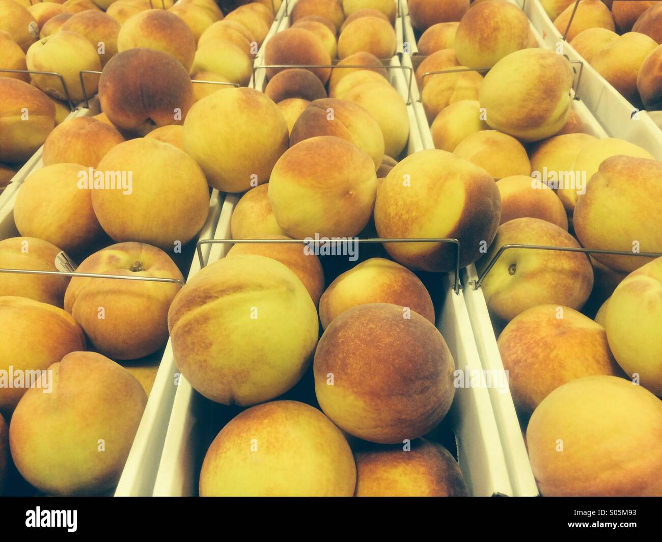Baskets of fresh local peaches at a roadside stand in Georgia. - Smartphone Captured Stock Image