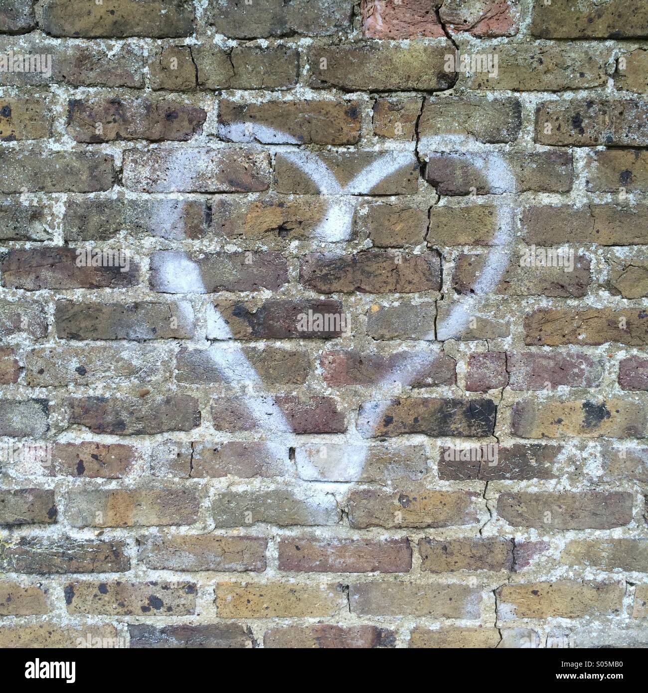 Heart Shape Spray Painted onto a Brick Wall Stock Photo Alamy
