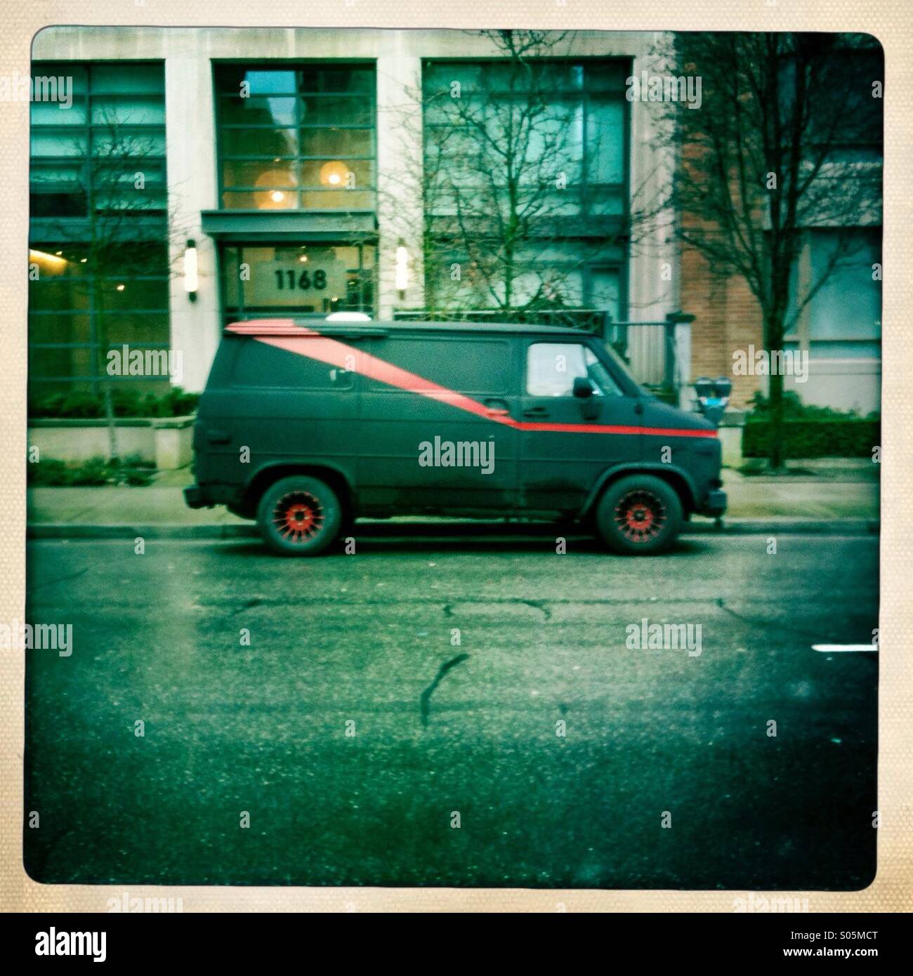 What looks to be the a-team van parked outside a building. Stock Photo