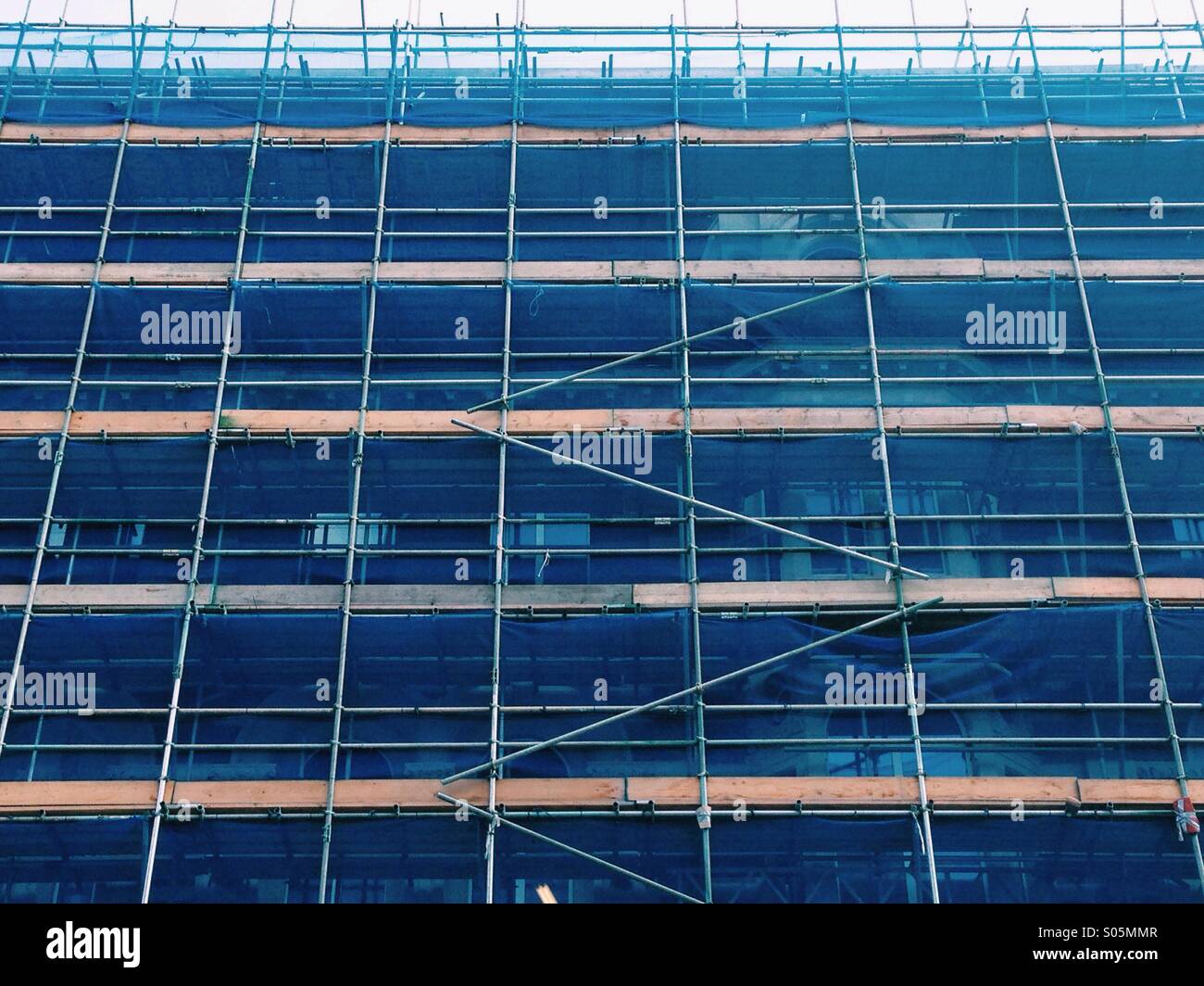 Building covered in canvas and scaffolding Stock Photo Alamy