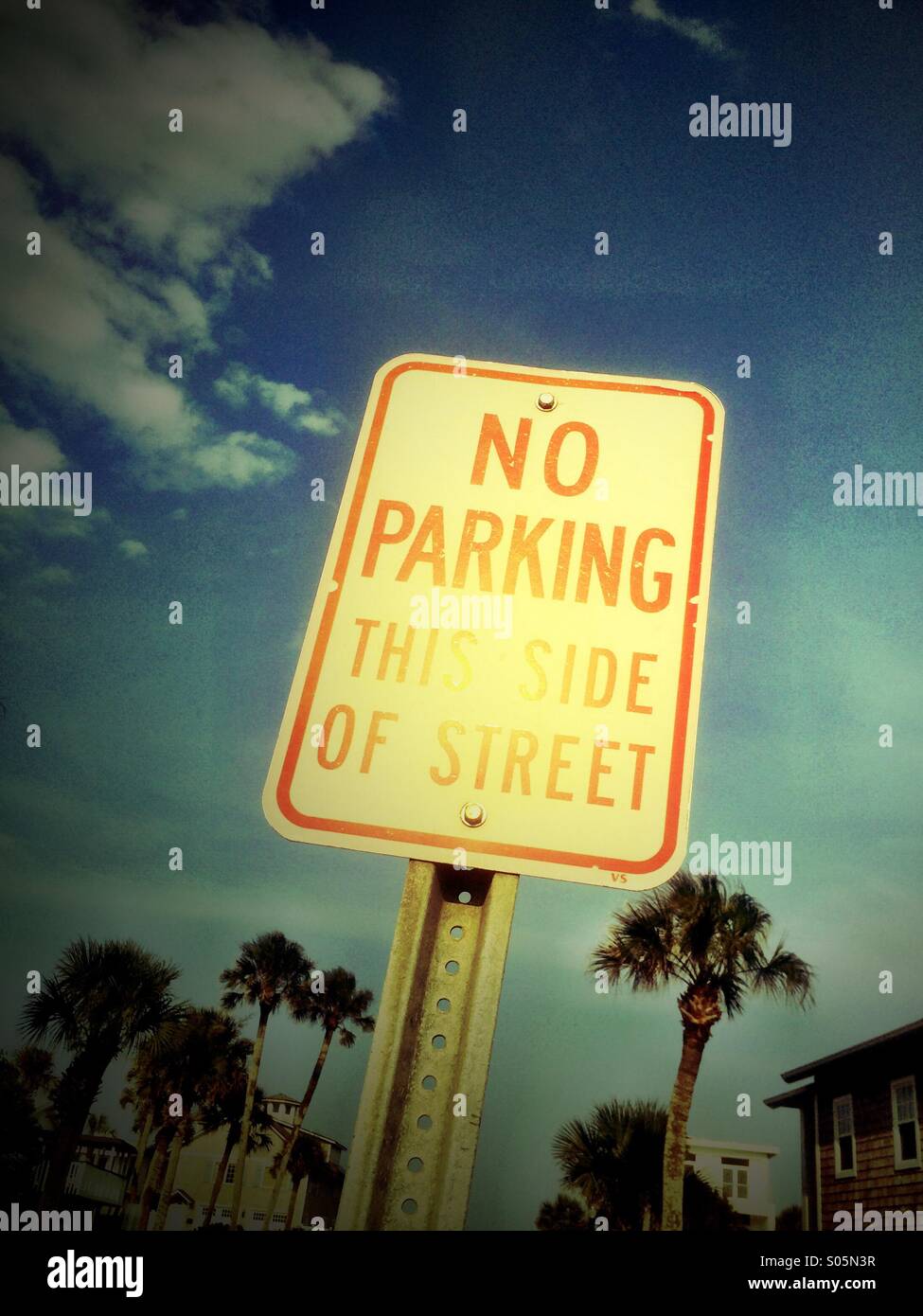 No Parking On This Side Of The Street road sign. - Smartphone Captured Stock Image