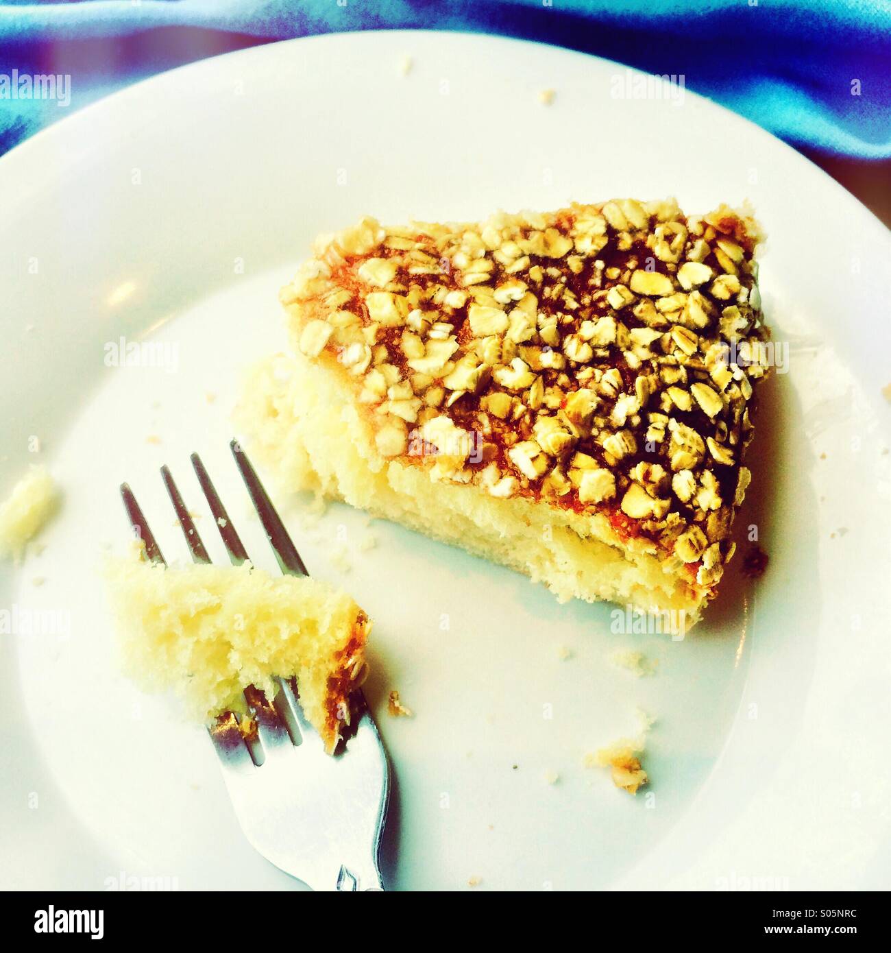 Cake with oatmeal flakes and fork. - Smartphone Captured Stock Image