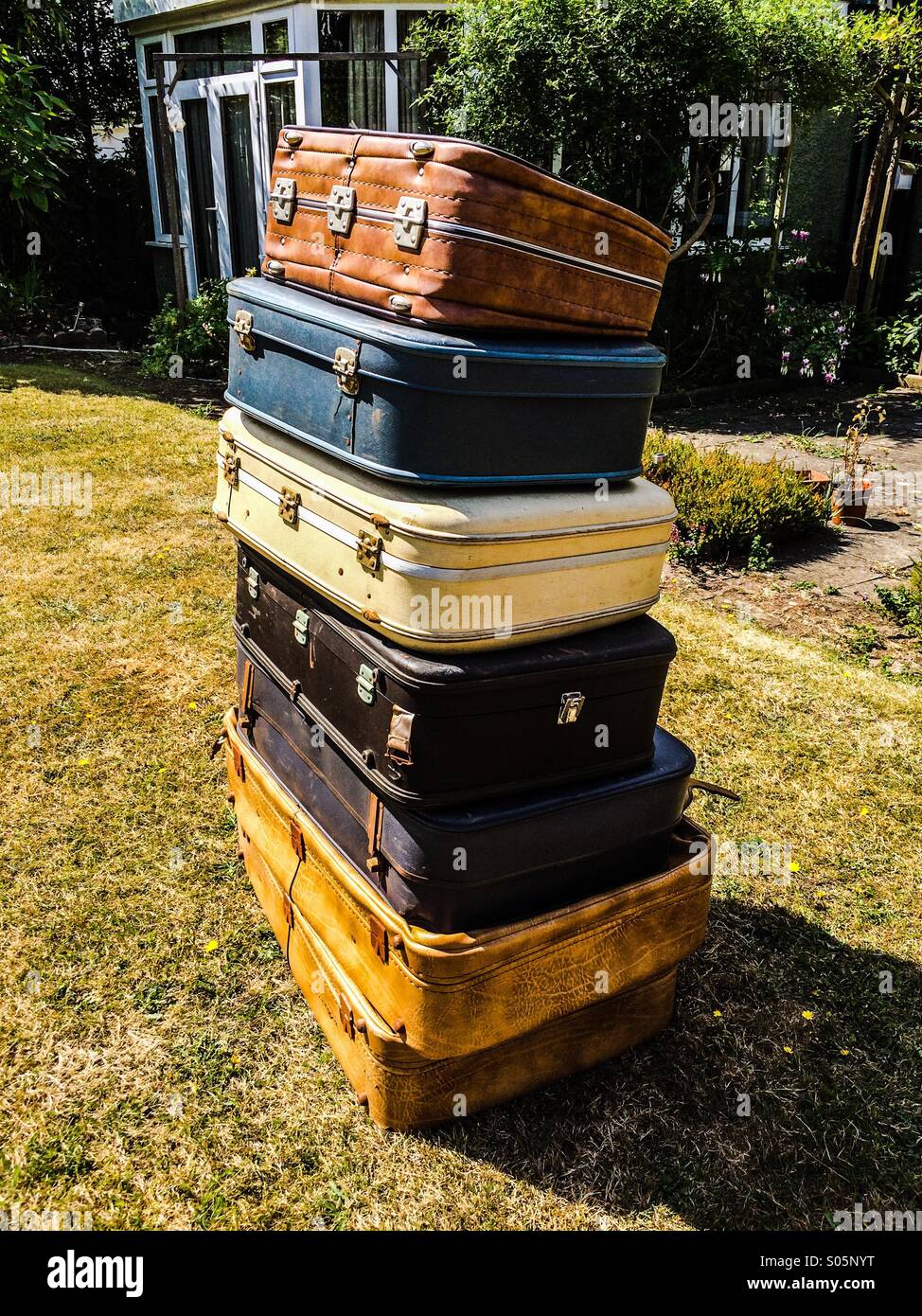 Shabby chic storage  solution old suitcase stack Stock Photo