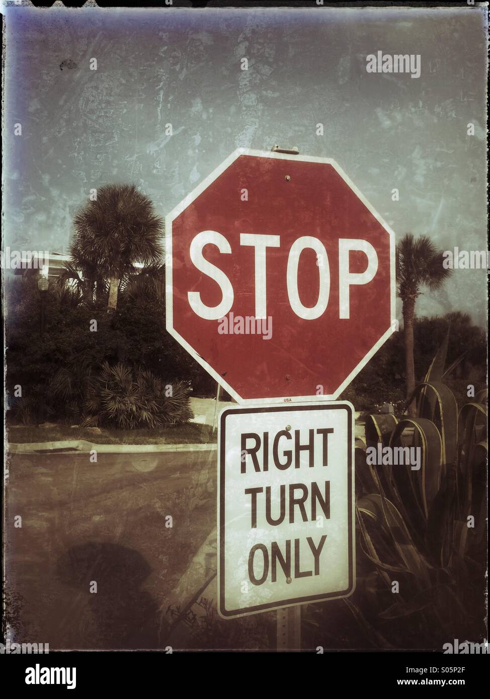Stop, right turn only road sign. Stock Photo
