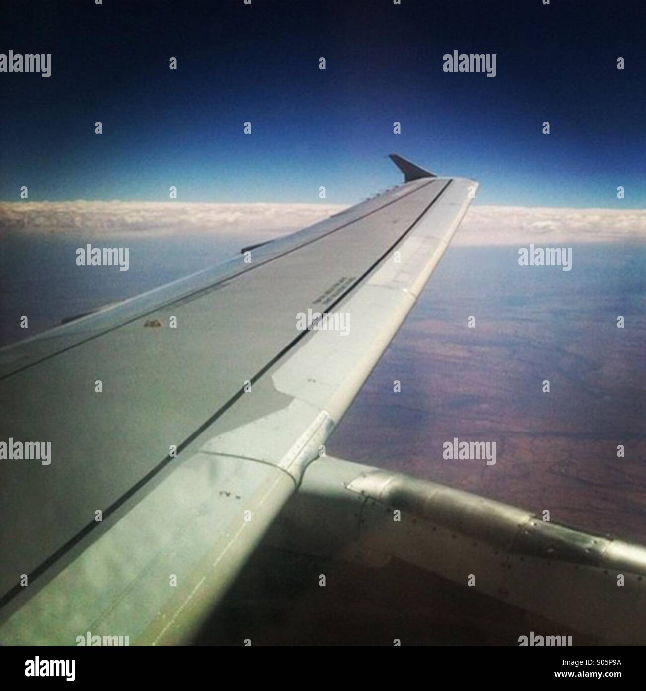 View of an airplane wing during flight Stock Photo - Alamy