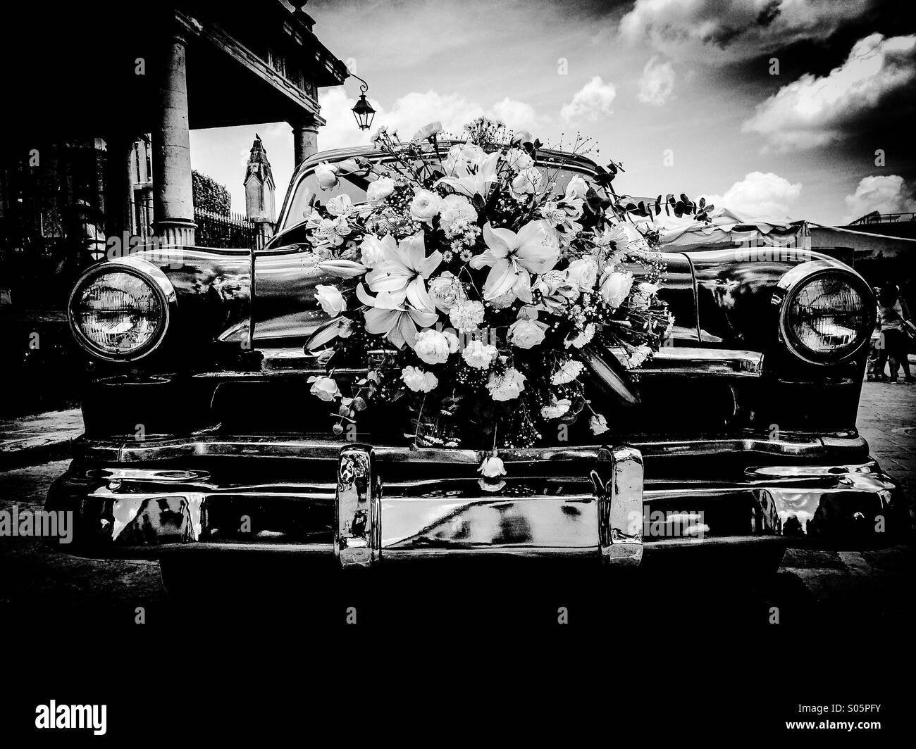 Classic black 50's Chevrolet front fixed with white flowers crown for a wedding Stock Photo