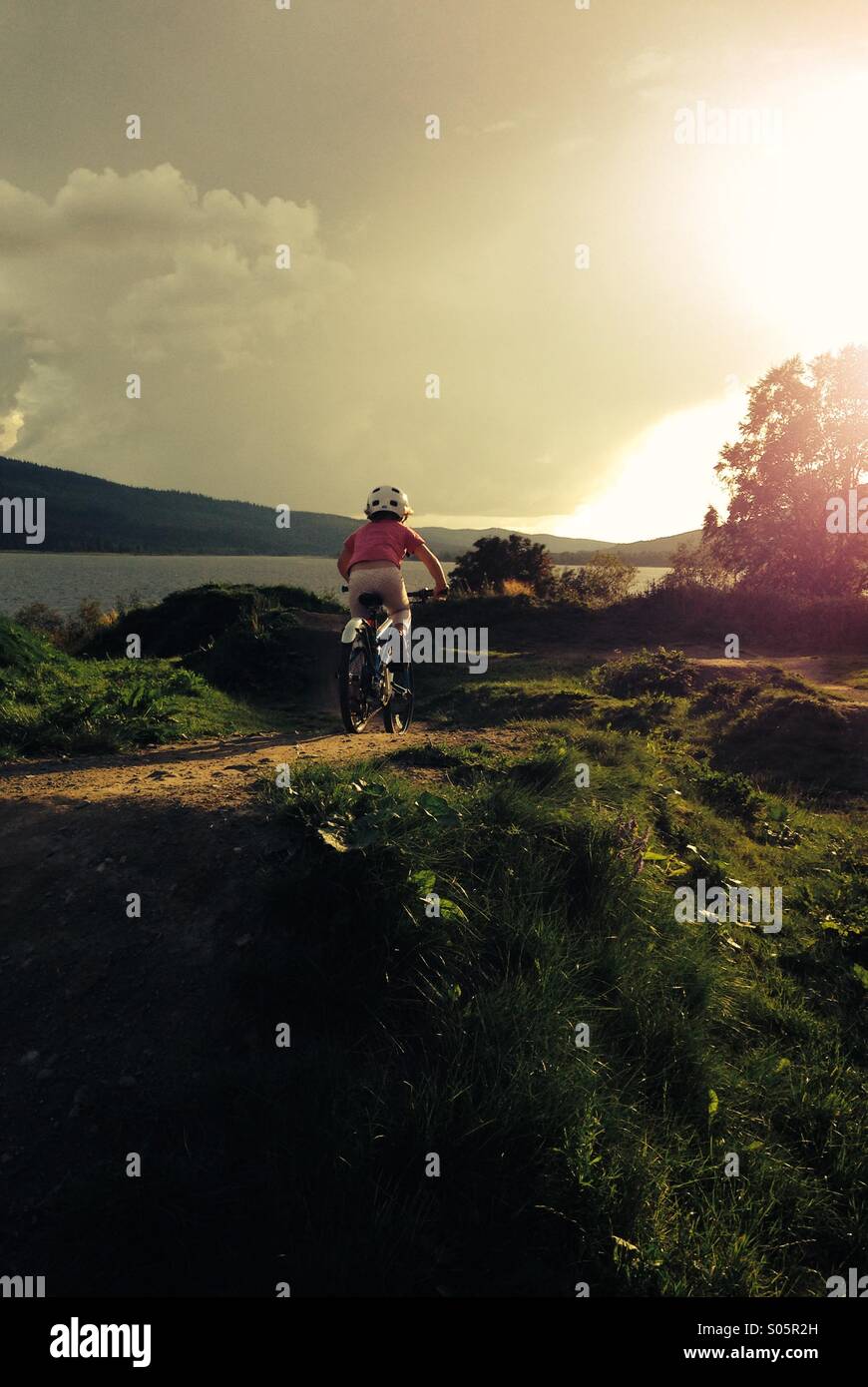 Girl riding a bike, Åre, Sweden. MR available. - Smartphone Captured Stock Image