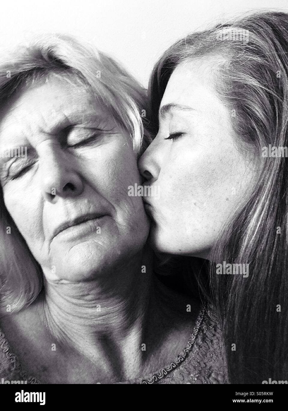 black girl kissing white girl