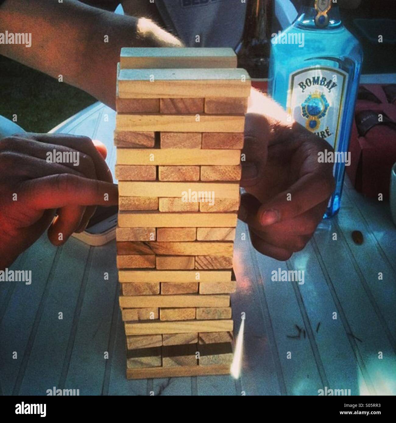 Playing a game of Jenga Stock Photo Alamy