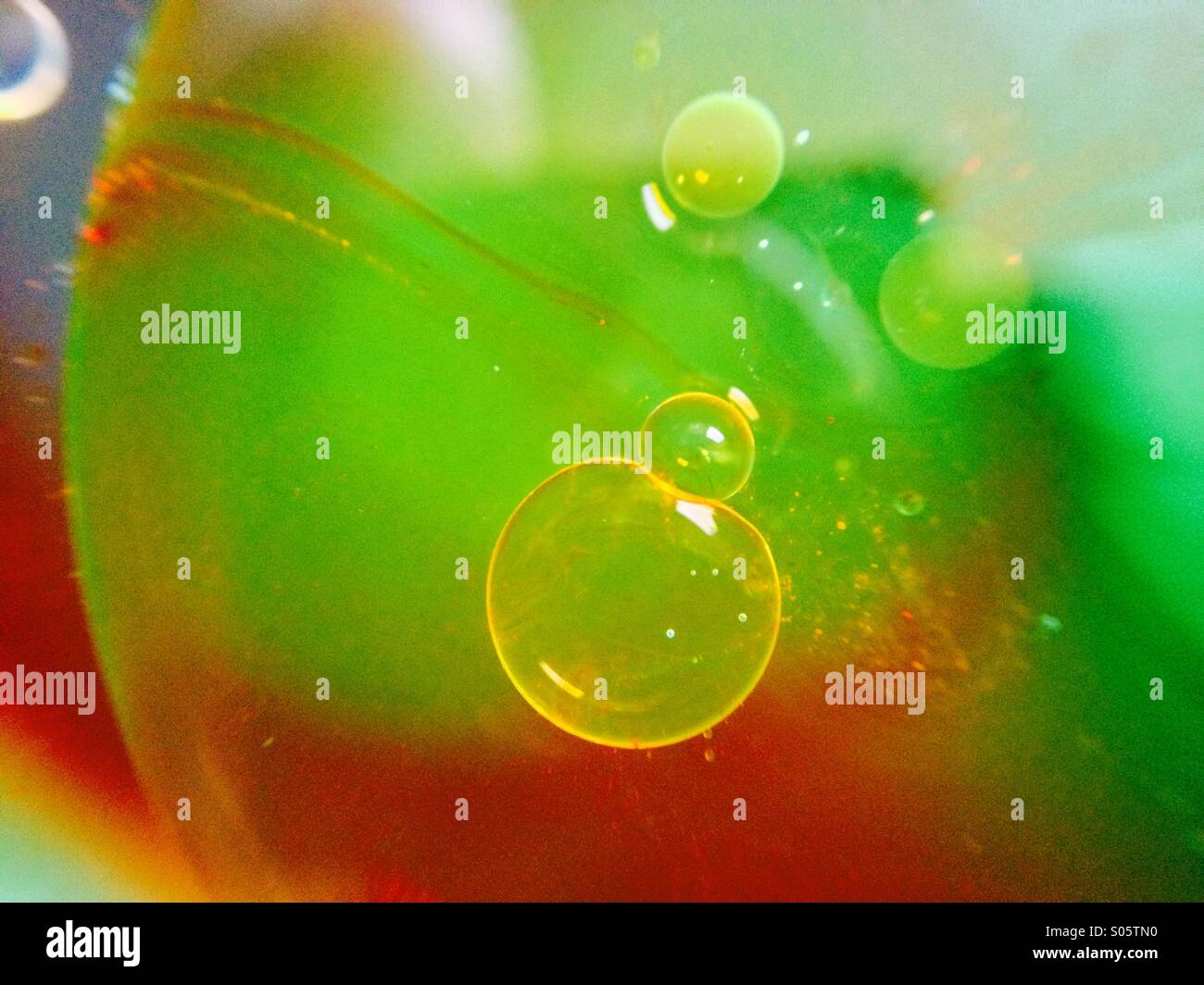 Oil bubble floating on water - Smartphone Captured Stock Image