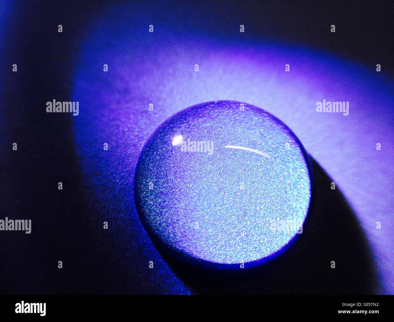 Water drop on a blue background - Smartphone Captured Stock Image