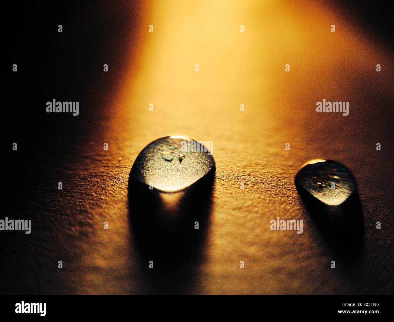 Water drop lit by a torch - Smartphone Captured Stock Image