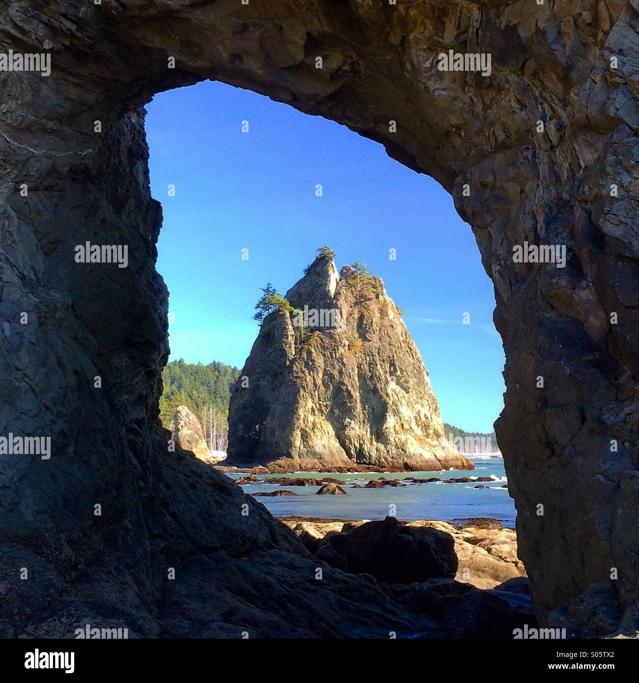 Sea Stacks through natural arch, Rialto Beach, Olympic National Park,  Washington - Smartphone Captured Stock Image