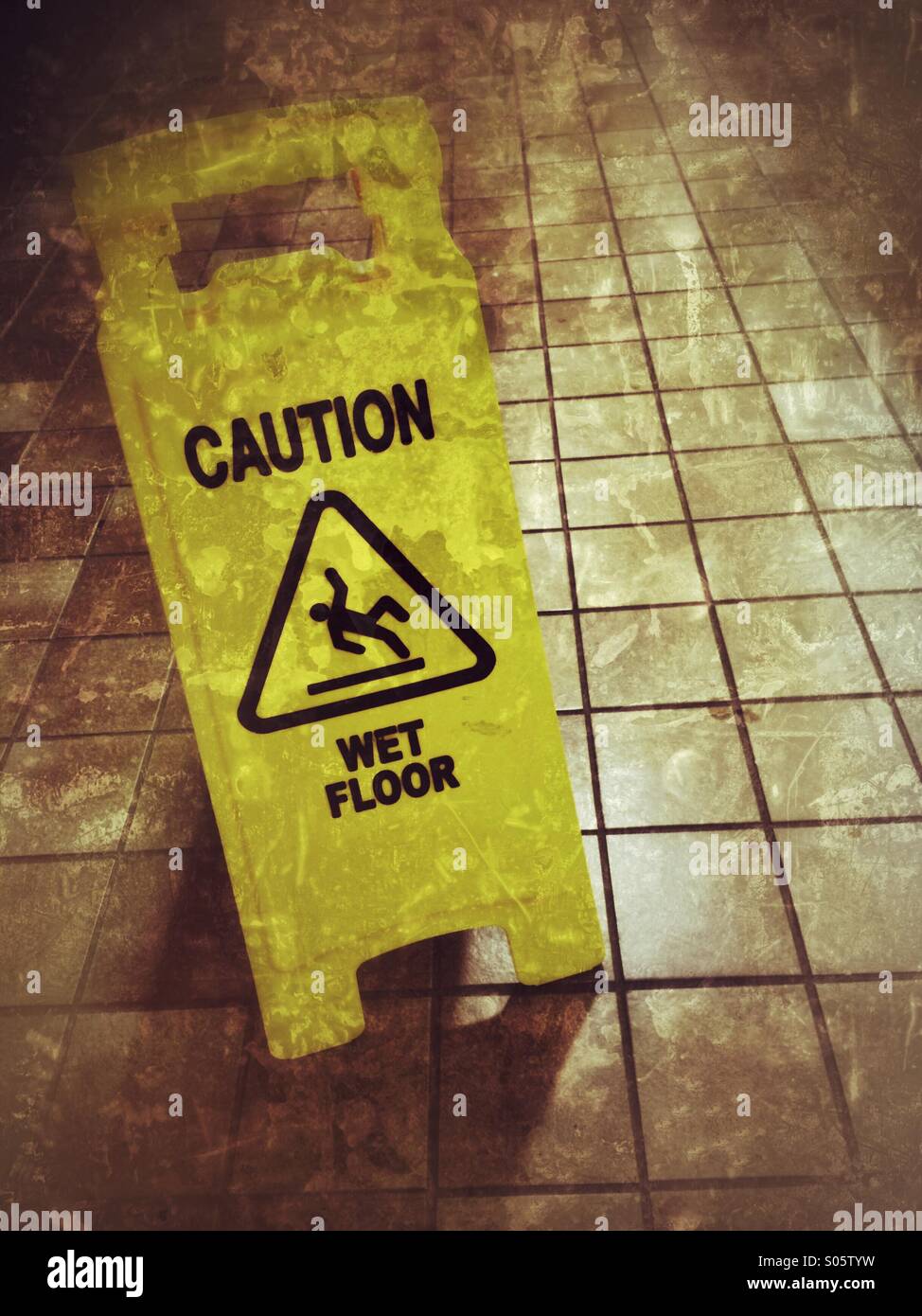 Wet floor warning sign. - Smartphone Captured Stock Image