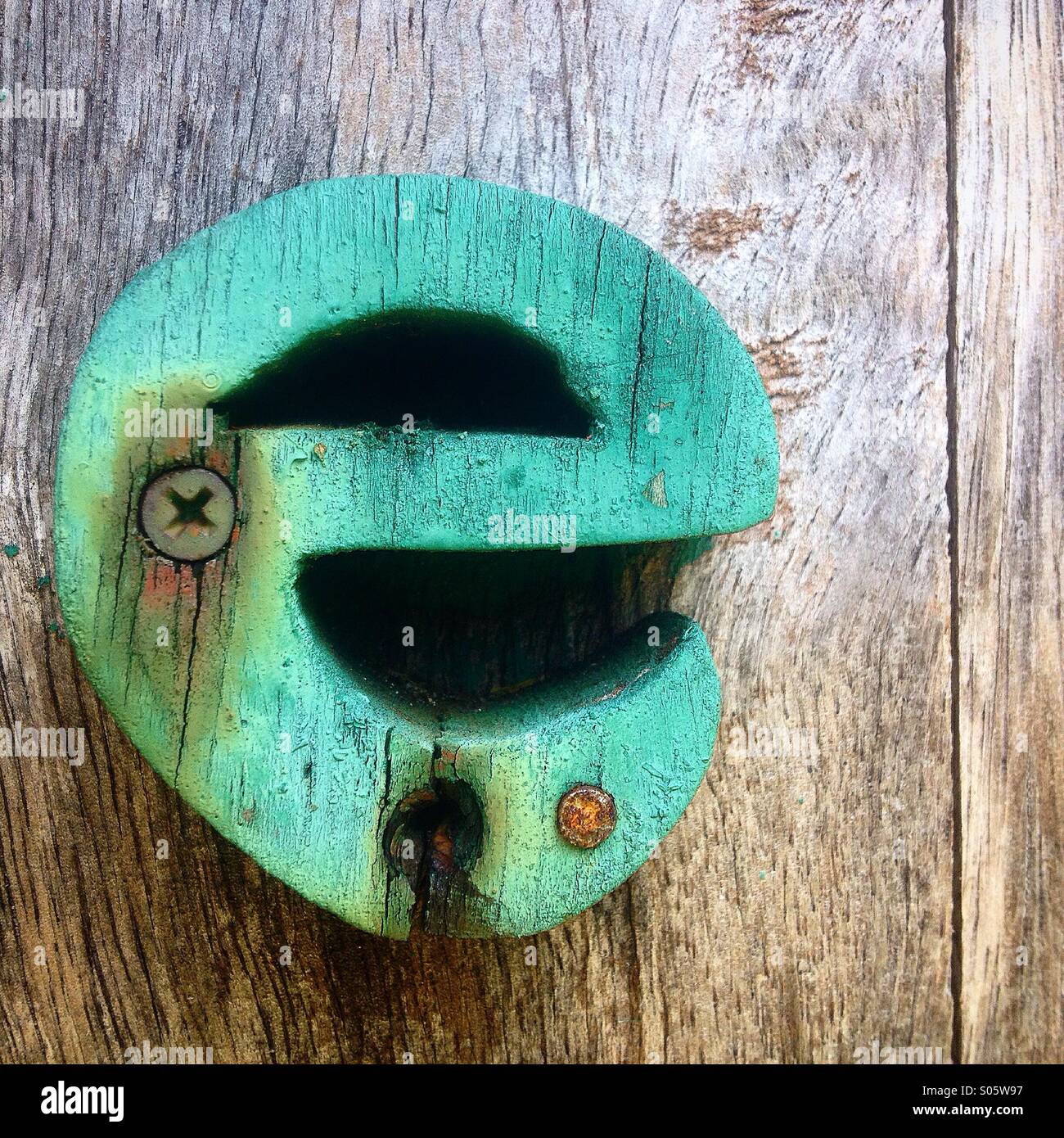 A green wooden letter E decorates a hotel in Valladolid, Yucatan, Mexico - Smartphone Captured Stock Image