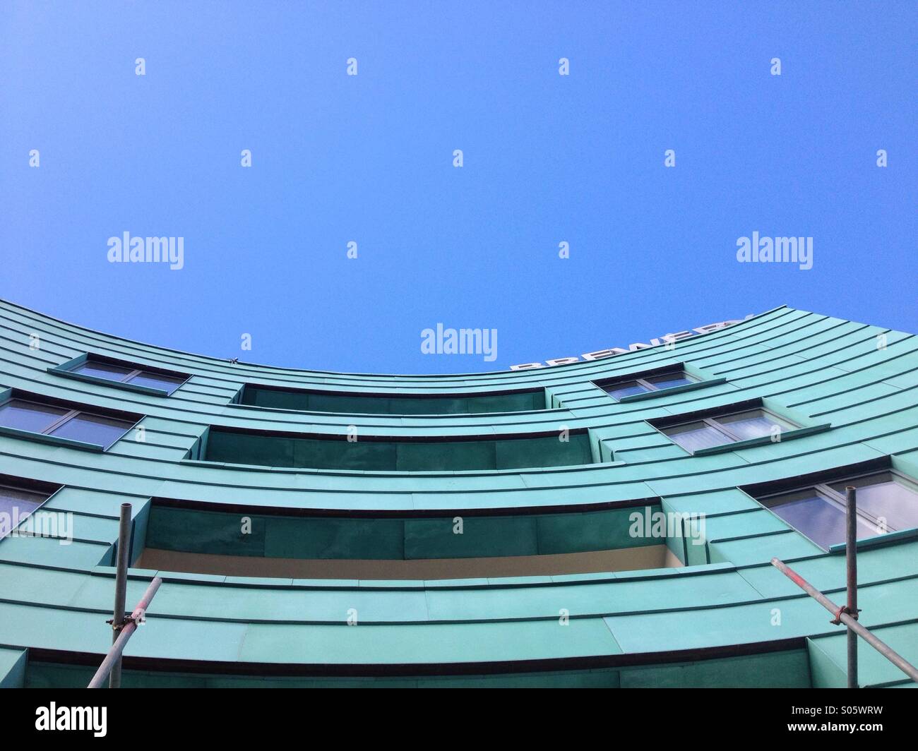 Blue sky over new build hotel Stock Photo