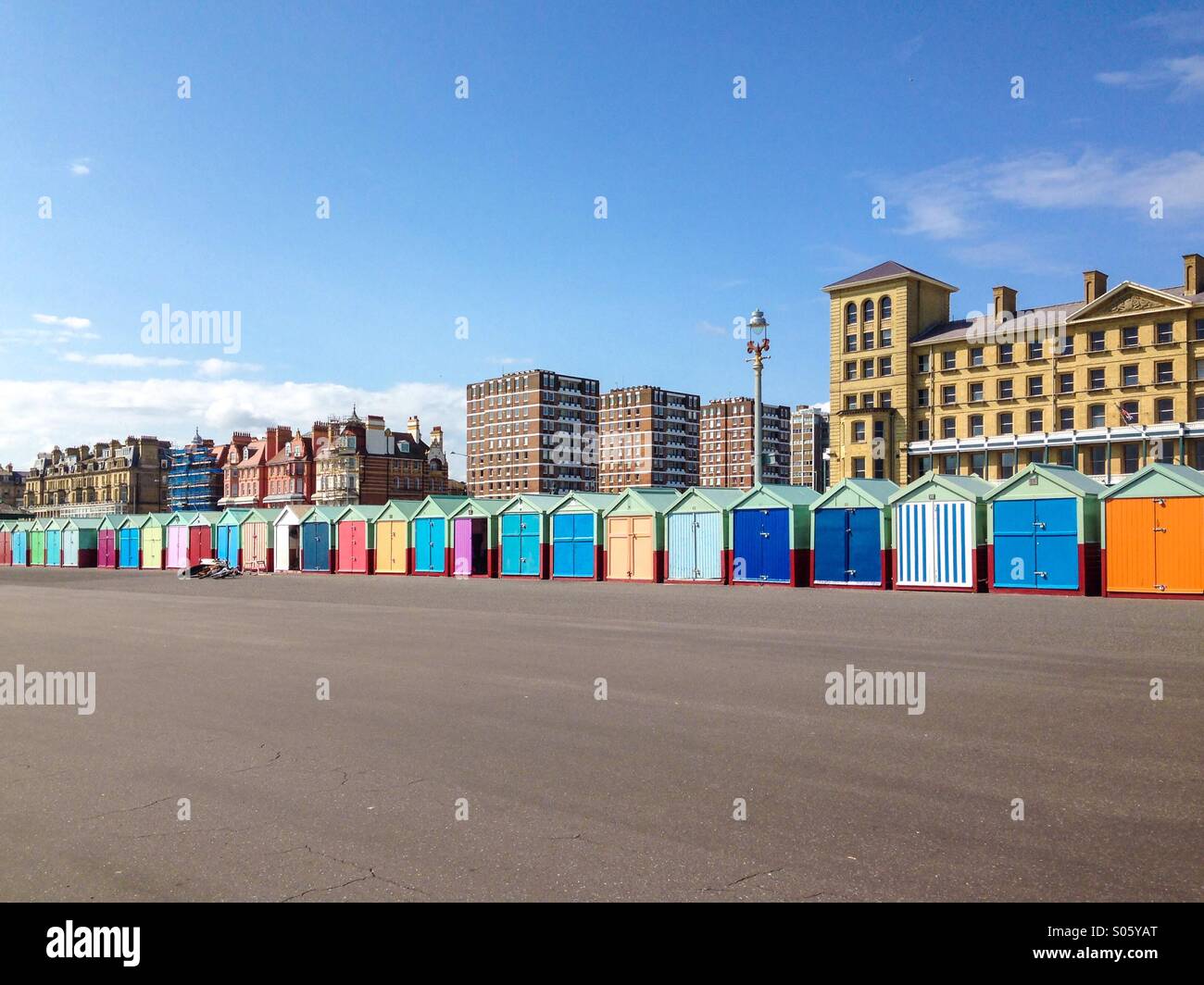 Row of colourful beach huts in Brighton and Hove Stock Photo