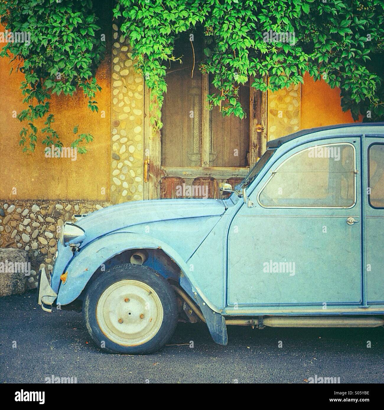 Vintage blue Citroën 2cv parked in front of a house in Castellet, Vaucluse, Provence-Alpes-Côte-d'Azur, France Stock Photo