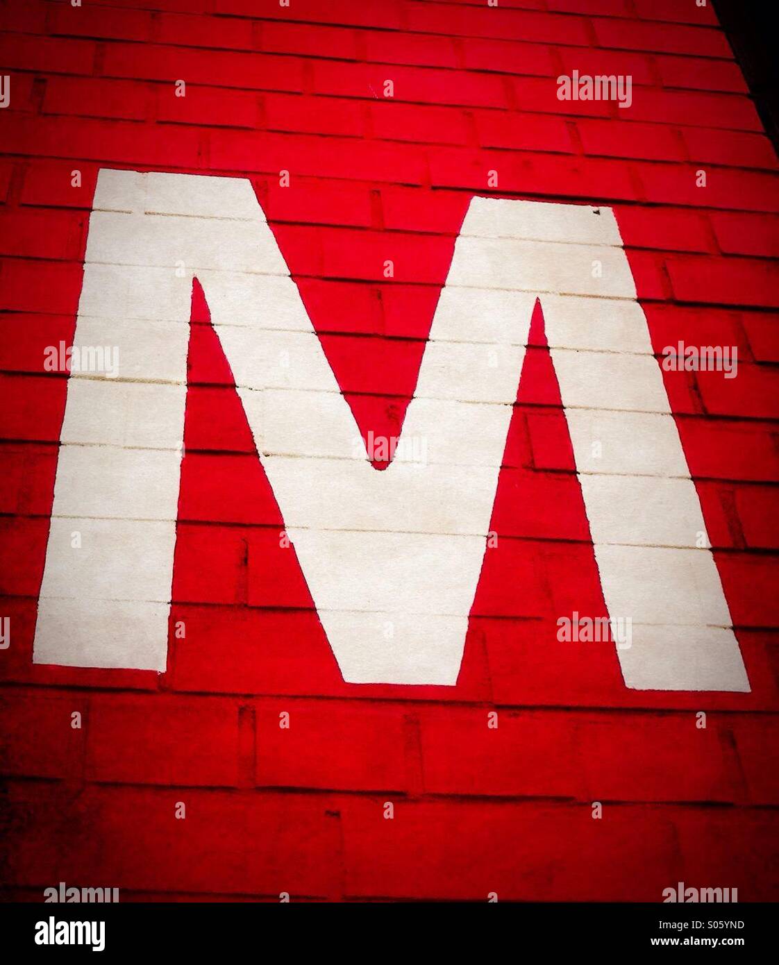 Letter "M" written on brick wall Stock Photo Alamy