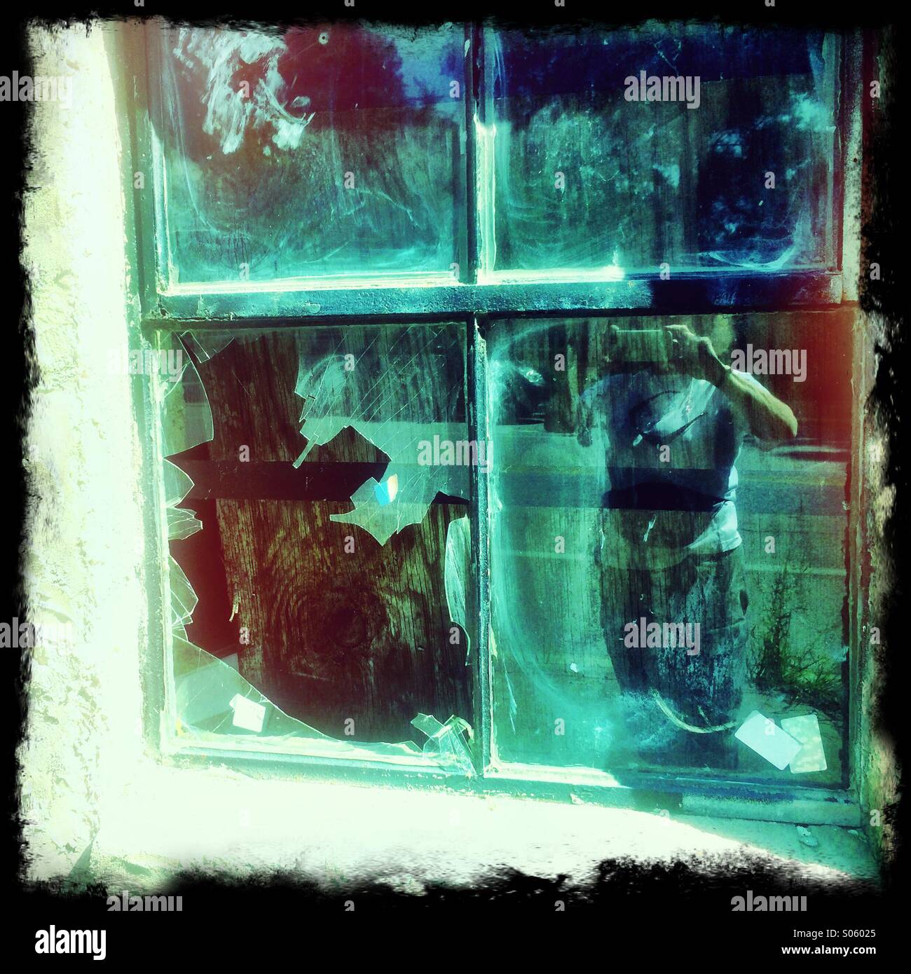 Broken and boarded up window. - Smartphone Captured Stock Image