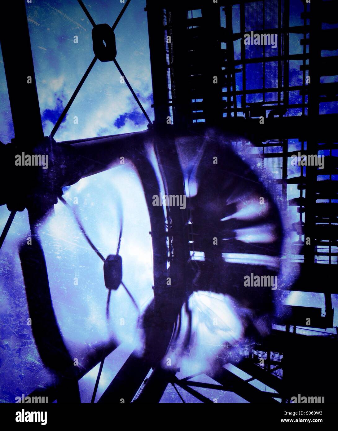 Looking up at structure and mechanism of Anderton boat lift through distortion of rain drop - Smartphone Captured Stock Image