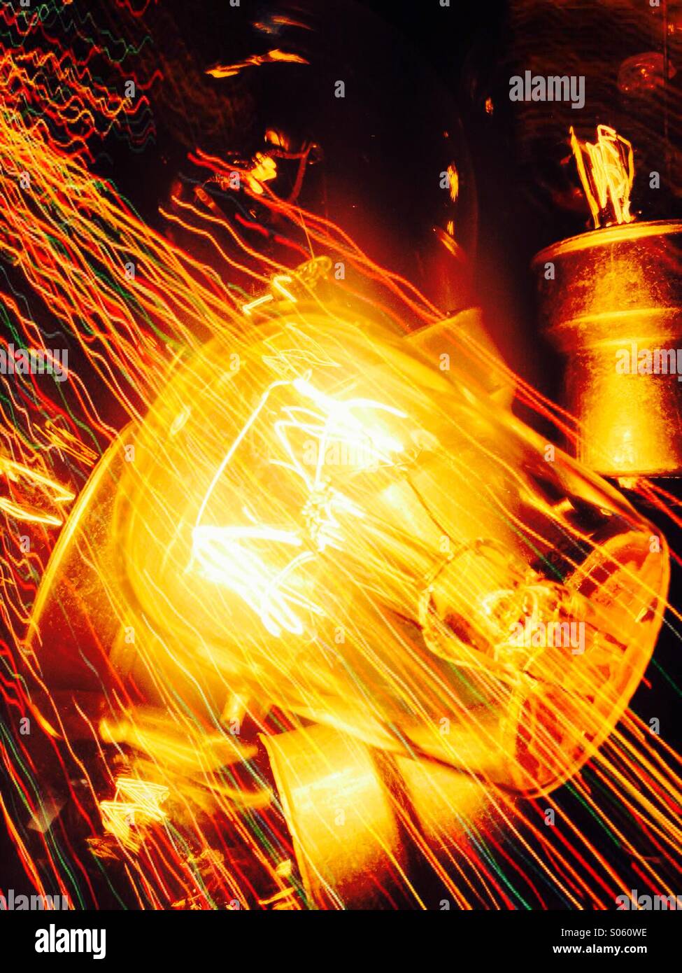 Illuminated light bulb with light trails - Smartphone Captured Stock Image