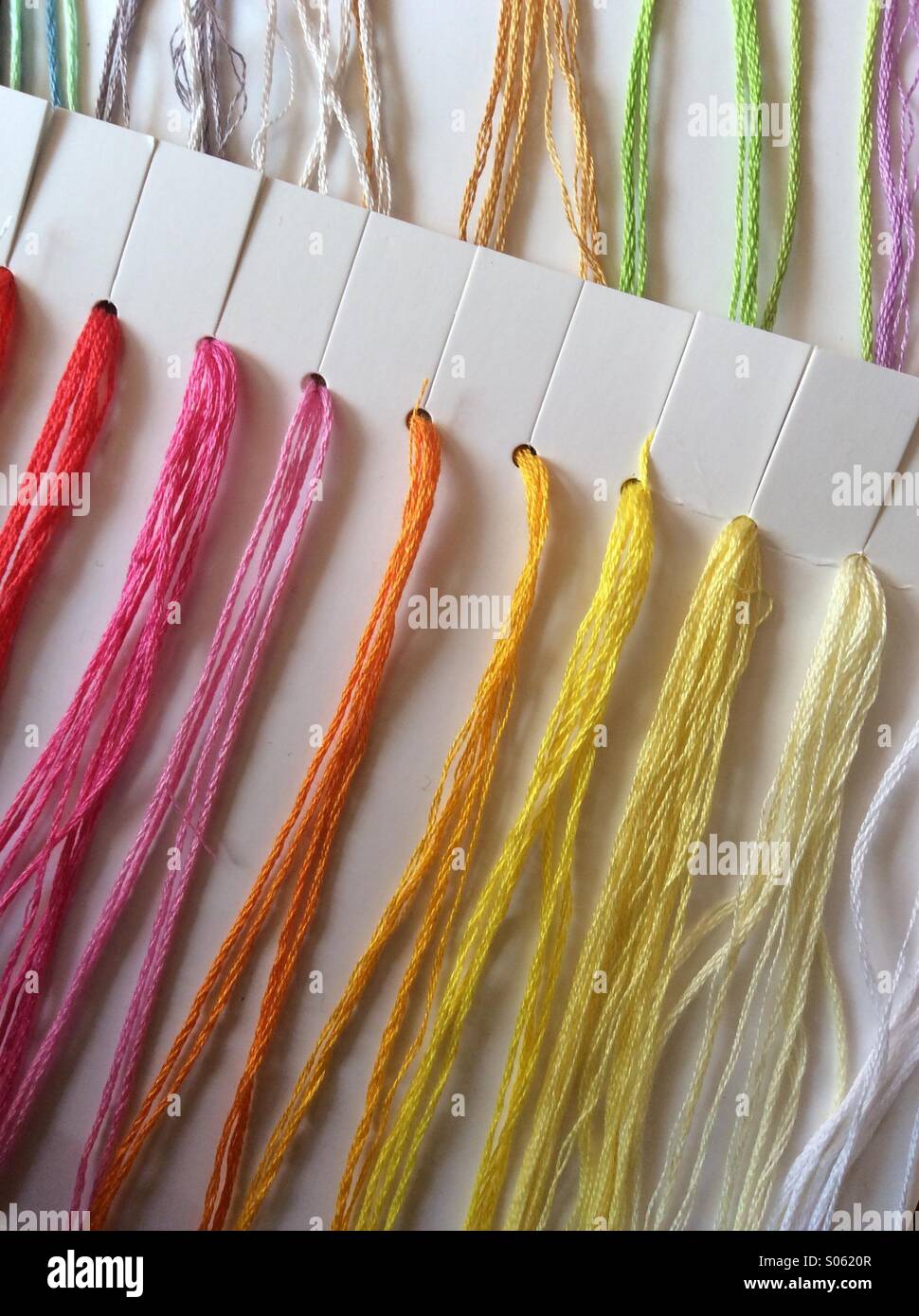 Brightly coloured sewing threads Stock Photo
