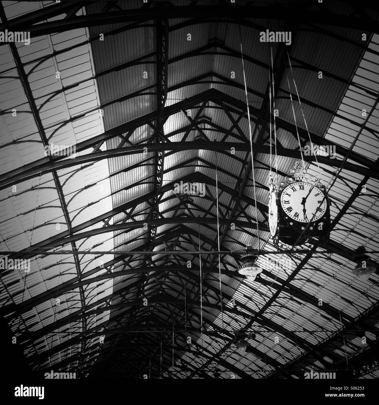 A big clock in the Brighton train station. Brighton England UK - Smartphone Captured Stock Image