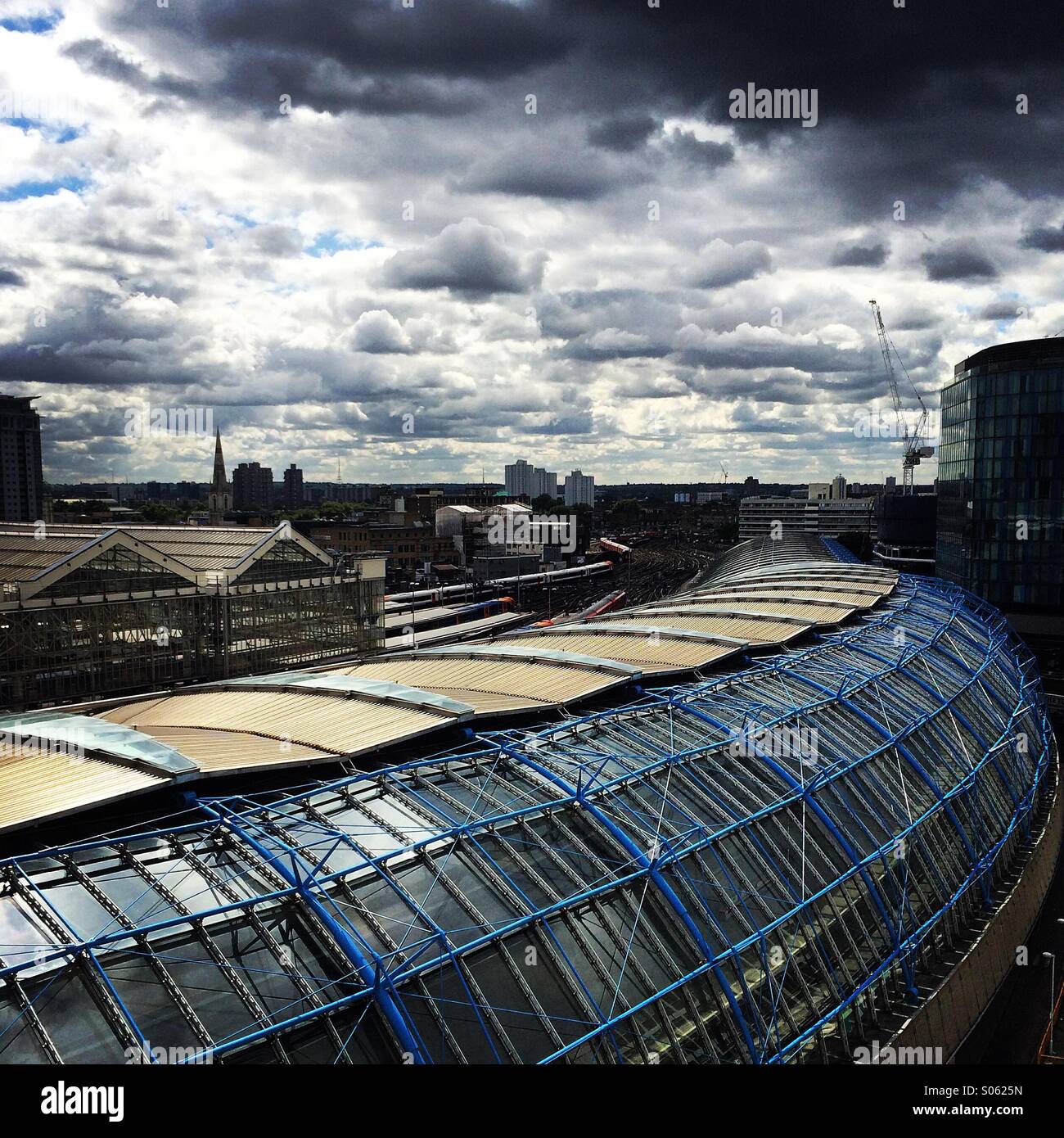 Waterloo Station roof sweep under stormy sky Stock Photo