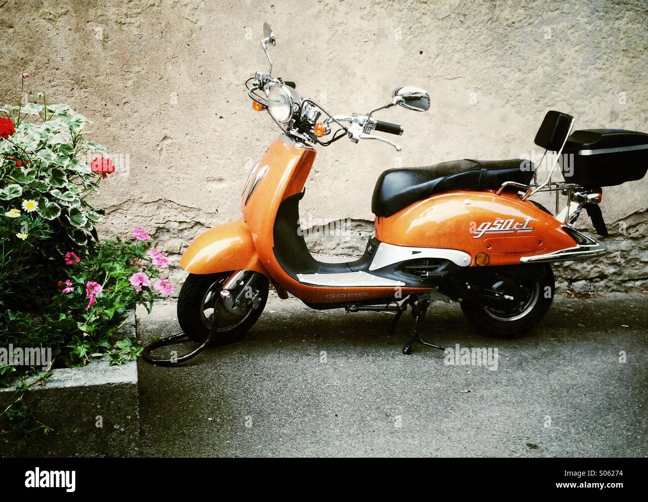 Orange scooter, vintage Stock Photo - Alamy