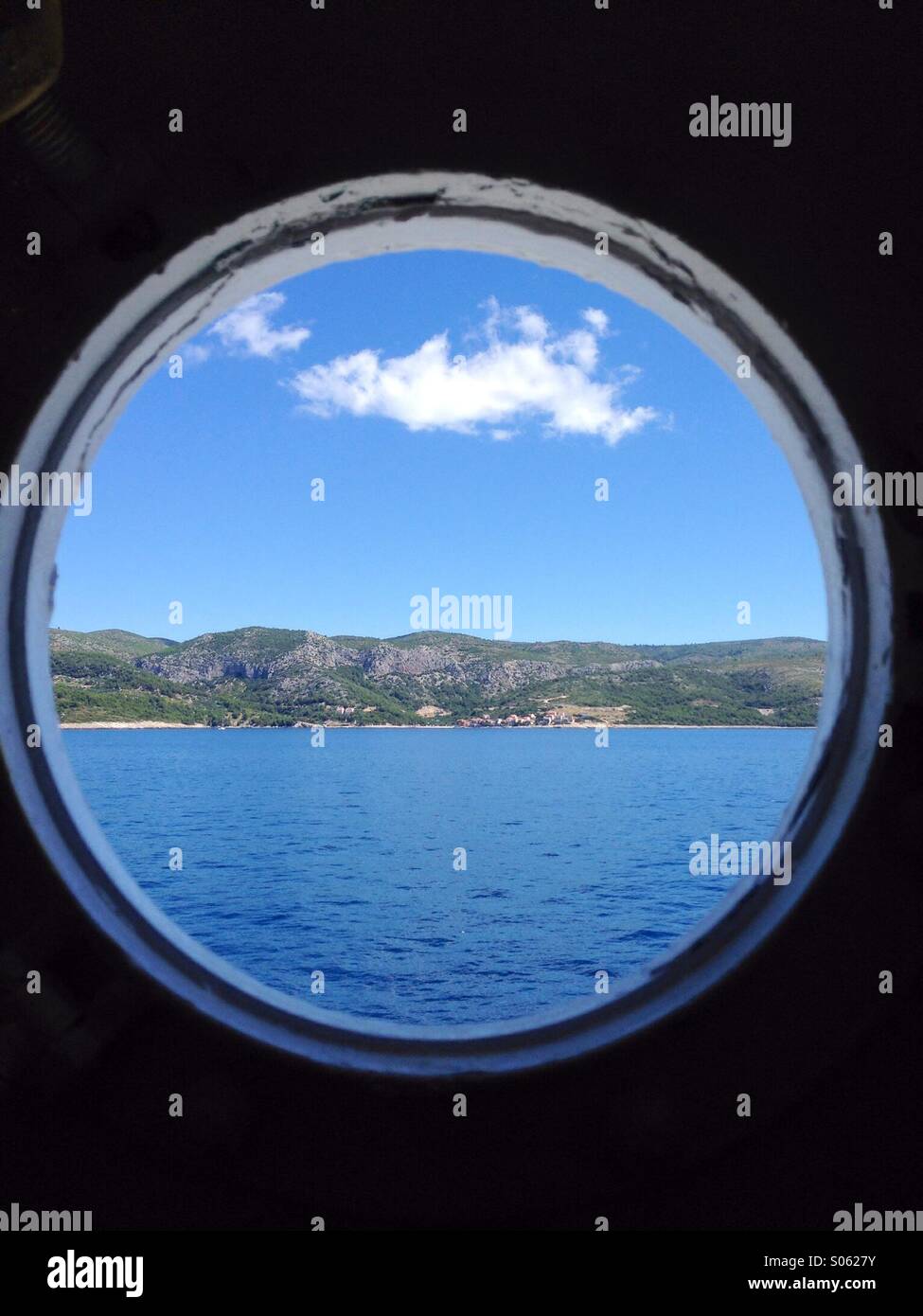 View through port hole on ship in Croatia Stock Photo