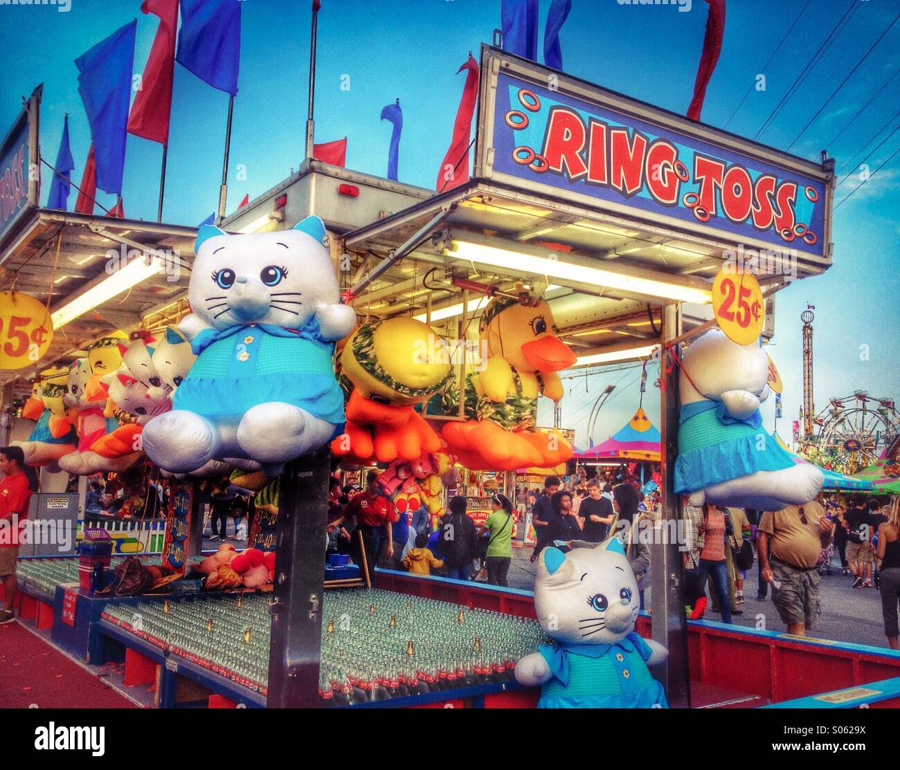Big cute stuffed toys for prizes at the Ring Toss Game at the summer fair. - Smartphone Captured Stock Image