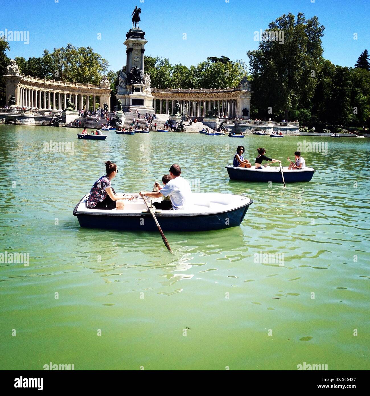 Soaking up the summer sun at Madrid's El Retiro park. - Smartphone Captured Stock Image