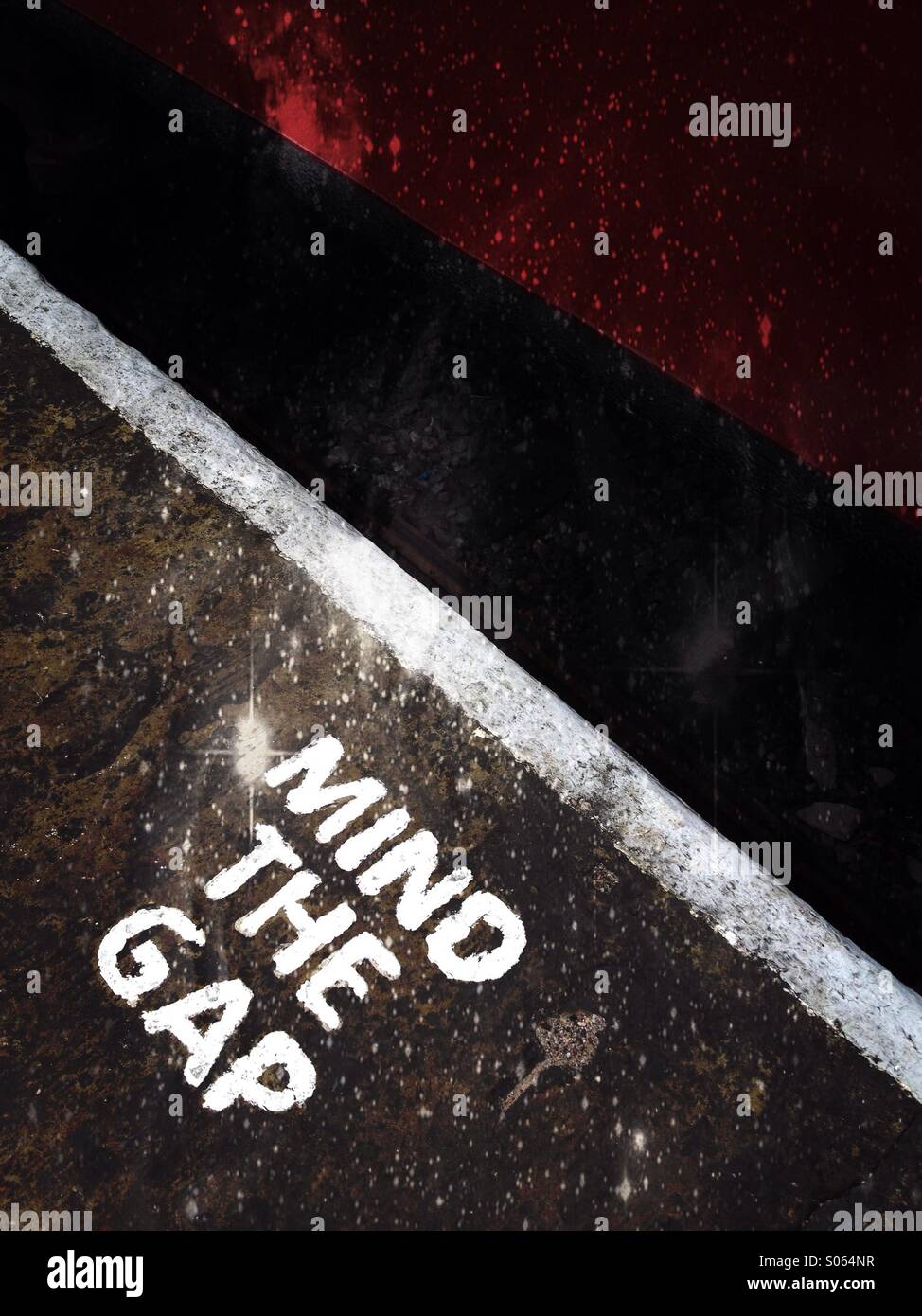 Close up of a mind the gap railway sign Stock Photo