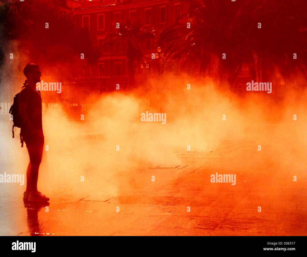 Man facing a fiery blaze - Smartphone Captured Stock Image