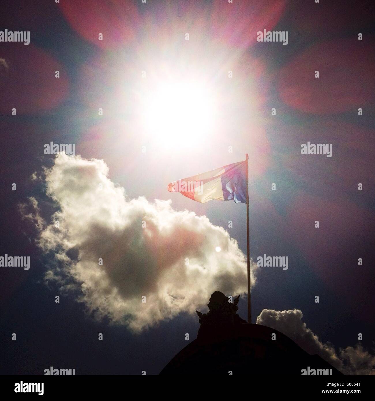 A French flag and a cloud. Paris France Europe Stock Photo